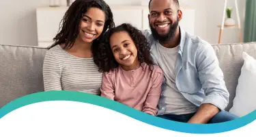 Happy family sitting together on a couch