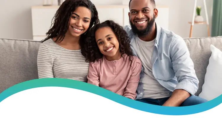 Happy family sitting together on a couch