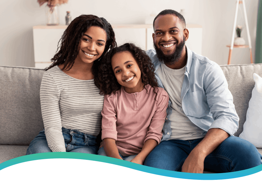 Happy family sitting together on a couch