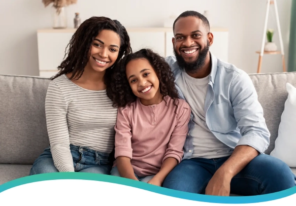 Happy family sitting together on a couch